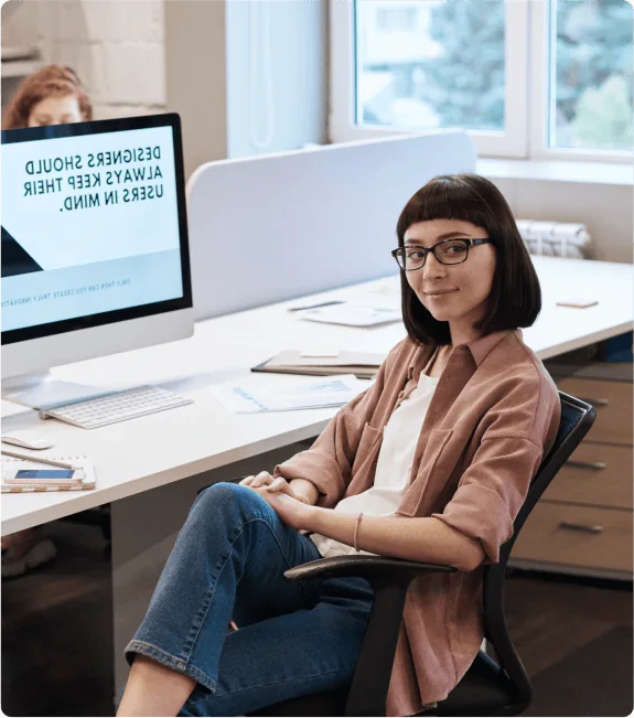 Developer working at her computer in the office
